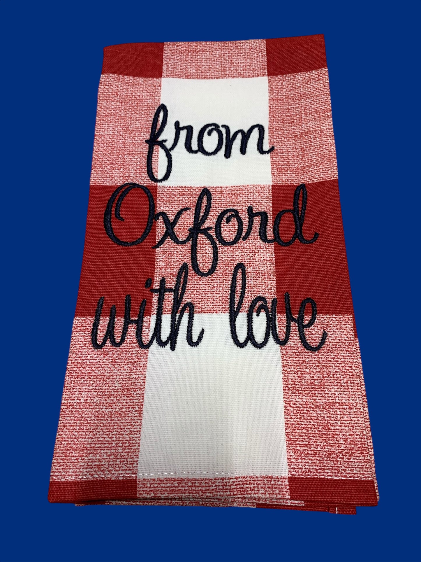Hand towel featuring embroidered "From Oxford With Love" text in black script on a red and white buffalo check background, perfect for Oxford fans or kitchen and home decor.