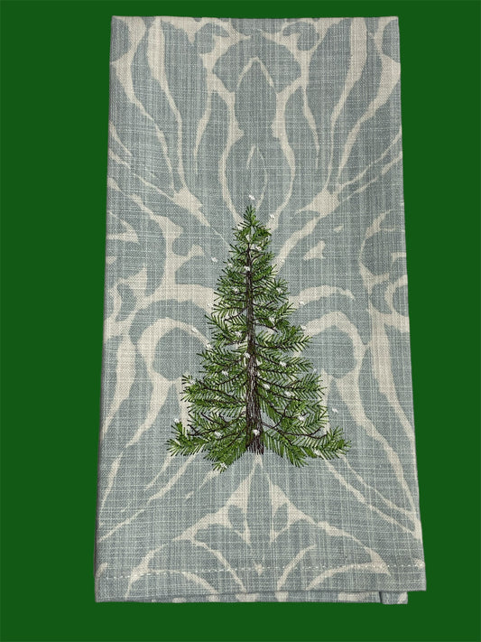 Decorative hand towel featuring embroidered Christmas pine tree on elegant patterned background, perfect for holiday and winter seasonal decor.