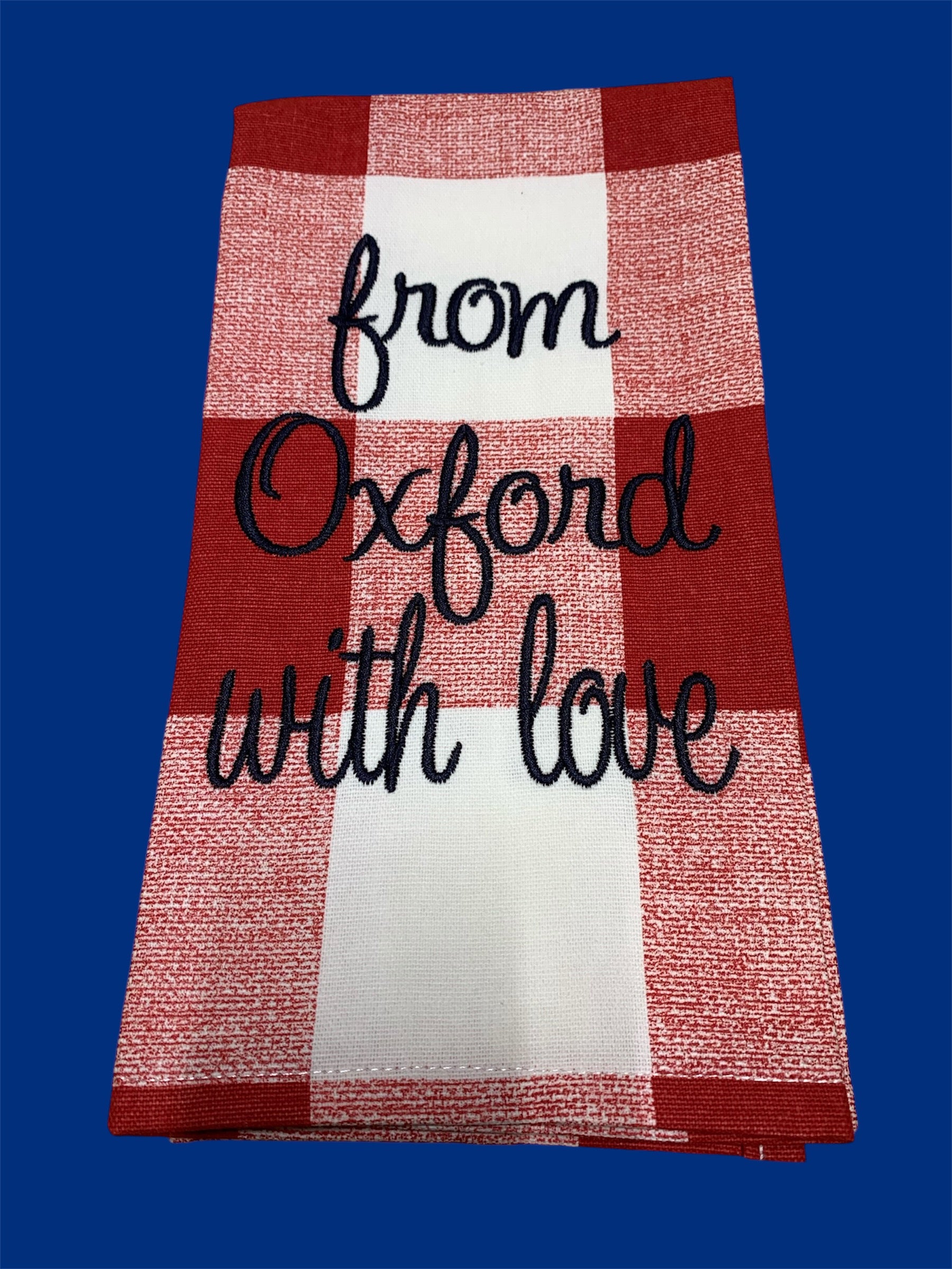 Hand towel featuring embroidered "From Oxford With Love" text in black script on a red and white buffalo check background, perfect for Oxford fans or kitchen and home decor.