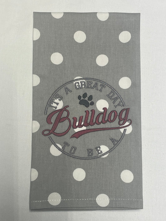 Hand towel featuring embroidered "It's a great day to be a Bulldog" text with paw print design on gray and white polka dot fabric, perfect for Mississippi State fans and college sports decor.