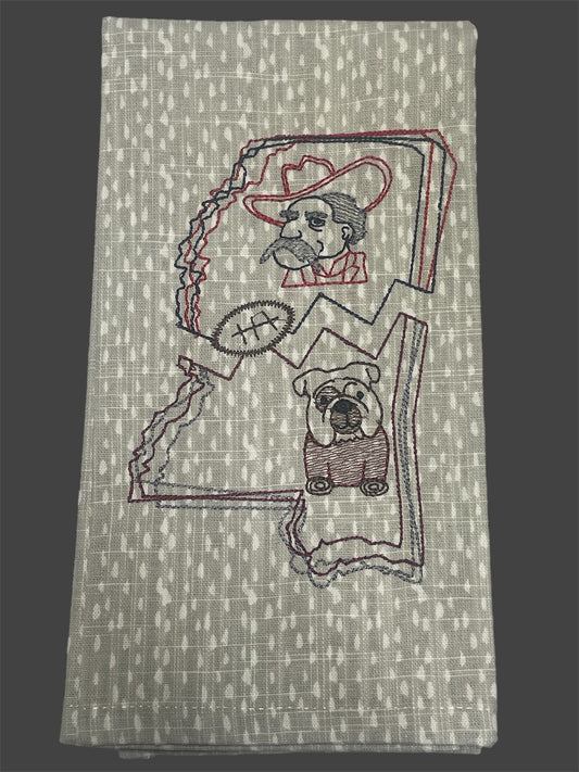 Decorative hand towel featuring embroidered Mississippi state outline with Colonel Reb, Bulldog mascot, and football design, perfect for Ole Miss and Mississippi State sports fans.