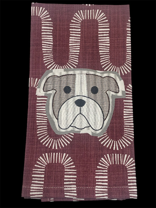 Decorative hand towel featuring embroidered Mississippi State University bulldog mascot on maroon patterned background, perfect for MSU fans and game day decor.