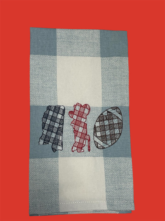 Embroidered hand towel featuring plaid designs of the state of Mississippi, a dog silhouette, and a football on a light blue and white checkered background, perfect for Ole Miss football fans and Southern decor.