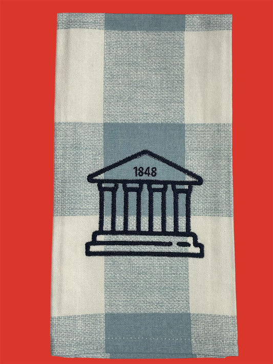 Decorative hand towel featuring embroidered Ole Miss Lyceum with "1848" detail on light blue and white checkered background, perfect for University of Mississippi fans and Oxford-inspired decor.