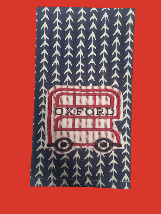 Decorative hand towel featuring embroidered Oxford bus design with red and white stripes on a navy background with white arrow pattern, perfect for Ole Miss fans, kitchen decor, or Southern gift ideas.