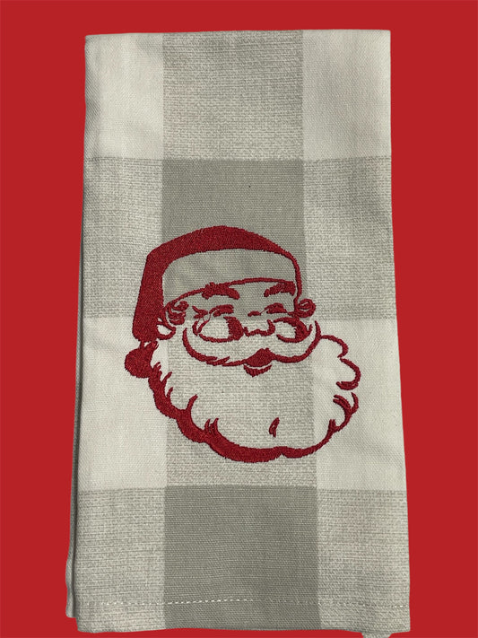 Decorative hand towel featuring embroidered vintage Santa Claus face in red on neutral plaid background, perfect for Christmas holiday kitchen or bathroom decor.